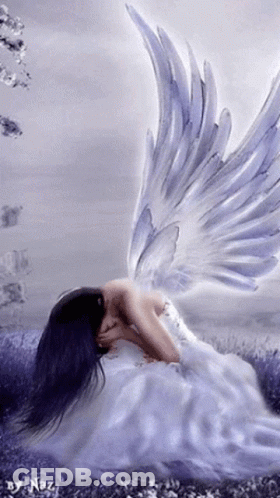 A Woman In A White Dress With Angel Wings Is Kneeling Down GIF