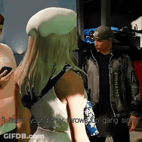A Woman In A White Hat Says " I Heard Your P ** Sy Throws Up Gang Signs " GIF