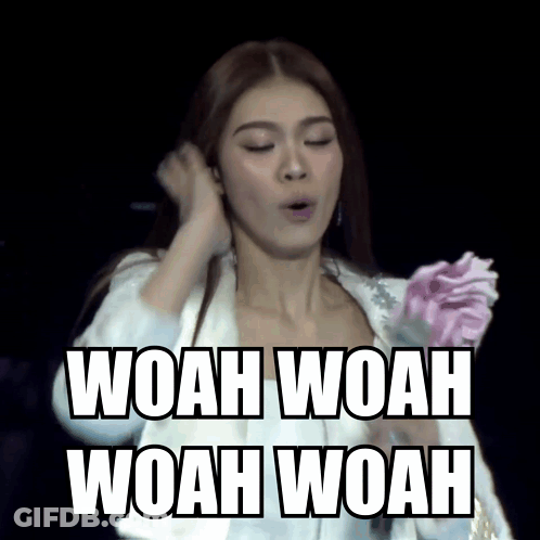 A Woman In A White Jacket Is Holding A Pink Flower And The Words Woah Woah Woah Woah Are Above Her GIF