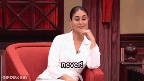 A Woman In A White Jacket Is Sitting In A Red Chair And Says " Never " GIF