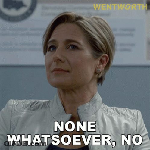 A Woman In A White Jacket Says " None Whatsoever, No " GIF