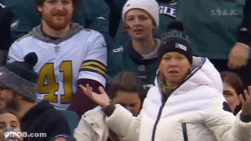 A Woman In A White Jacket With The Number 41 On Her Sleeve GIF