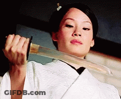 A Woman In A White Kimono Is Holding A Large Sword In Her Hands . GIF