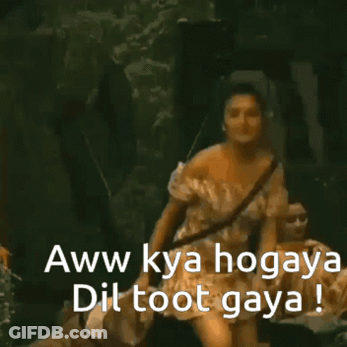 A Woman In A White Off The Shoulder Dress Says " Aww Kya Hogaya Dil Toot Gaya " GIF