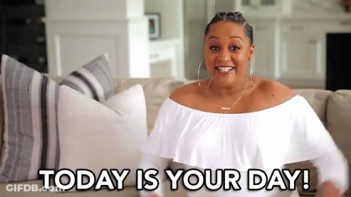 A Woman In A White Off The Shoulder Top Is Sitting On A Couch With The Words `` Today Is Your Day '' . GIF