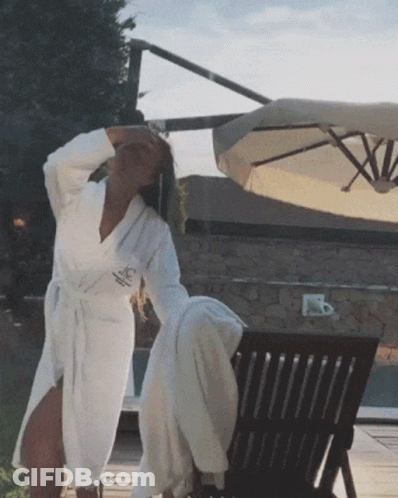Woman In White Robe With A Logo GIF