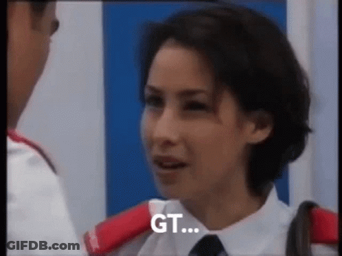 A Woman In A White Shirt And Tie Is Talking To A Man In A White Shirt And Tie . GIF
