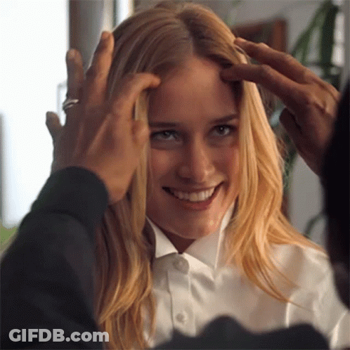 A Woman In A White Shirt Is Being Touched By A Man In A Black Shirt GIF