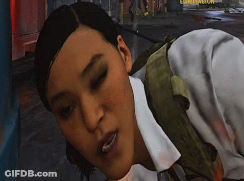 A Woman In A White Shirt Is Laying On The Ground In Front Of A Sign That Says Eliminacion GIF