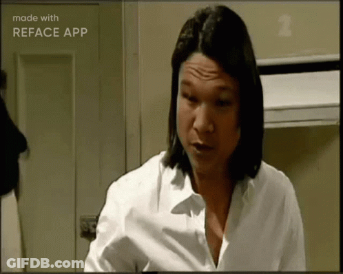 A Woman In A White Shirt Is Making A Funny Face And Is Made With Reface App GIF