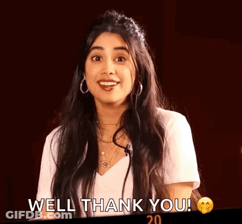 A Woman In A White Shirt Is Smiling And Saying Well Thank You . GIF