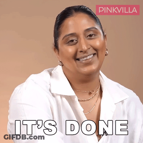 A Woman In A White Shirt Is Smiling With The Words It 'S Done Behind Her GIF