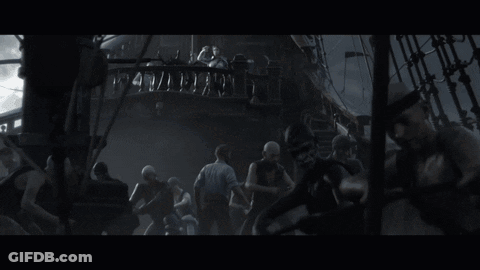 A Woman In A White Shirt Is Standing On A Ship GIF