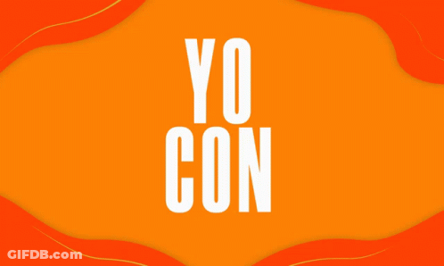 A Woman In A White Shirt Stands With Her Arms Crossed In Front Of An Orange Background GIF