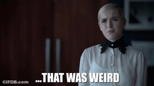 A Woman In A White Shirt With A Black Collar Says That Was Weird GIF