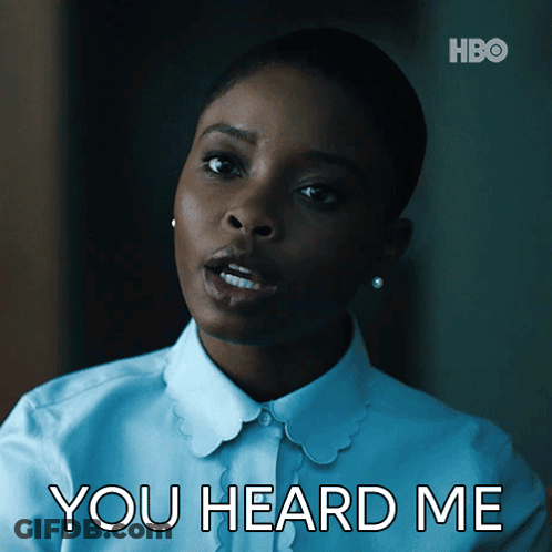 A Woman In A White Shirt With The Words You Heard Me Above Her GIF