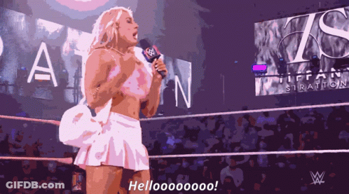 A Woman In A White Skirt Is Holding A Microphone And Says Hellooooooo GIF