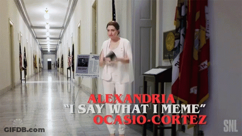 A Woman In A White Suit Is Standing In A Hallway With The Words Alexandria I Say What I Meme Ocasio Cortez GIF