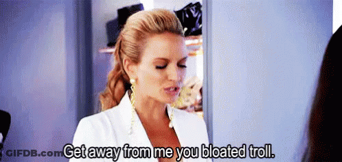 A Woman In A White Suit Is Talking To Another Woman In A Closet And Says Get Away From Me You Bloated Troll . GIF