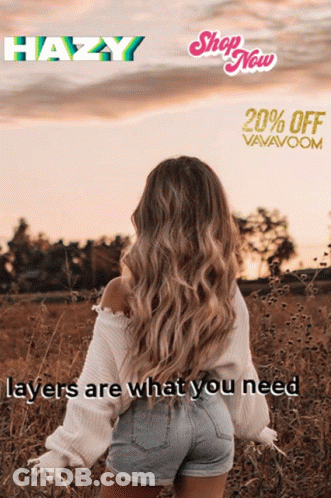 A Woman In A White Sweater And Shorts Is Standing In A Field Of Tall Grass GIF