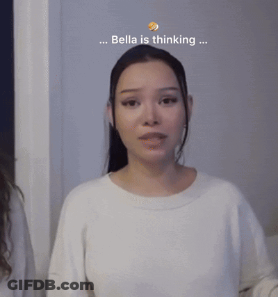 A Woman In A White Sweater With The Words Bella Is Thinking Behind Her GIF