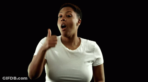 A Woman In A White T-Shirt Giving A Thumbs Up GIF