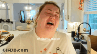 A Woman In A White T-Shirt With A Ghost On It Is Crying GIF