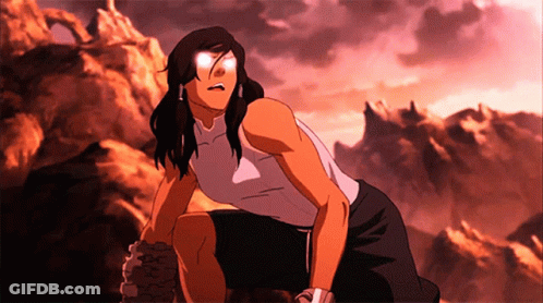 A Woman In A White Tank Top Is Kneeling Down In Front Of Mountains GIF