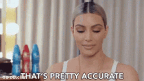 A Woman In A White Tank Top Is Sitting In Front Of A Mirror And Saying That 'S Pretty Accurate . GIF