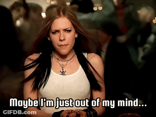 A Woman In A White Tank Top With The Words Maybe I 'M Just Out Of My Mind GIF