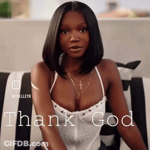 A Woman In A White Top Is Sitting On A Couch And The Words Thank God Are Behind Her GIF