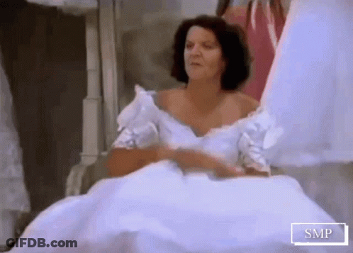 A Woman In A White Wedding Dress With Smp Written On The Bottom Of The Image GIF