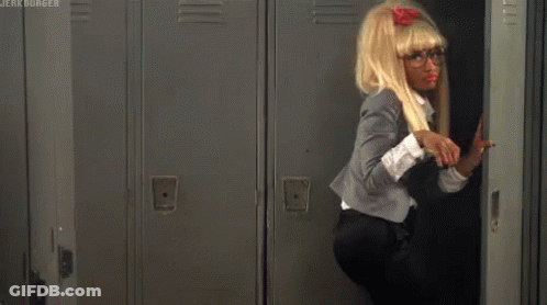 A Woman In A Wig And Glasses Is Standing In A Locker With The Words Jerk Burger On The Bottom Right GIF