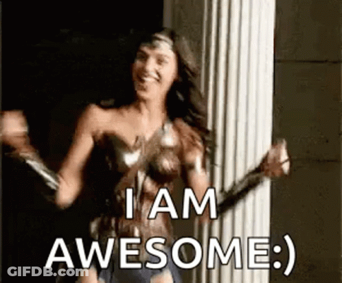 A Woman In A Wonder Woman Costume Is Dancing In Front Of A Pillar And Saying `` I Am Awesome '' . GIF