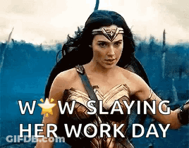 A Woman In A Wonder Woman Costume Is Holding A Sword And A Shield . GIF