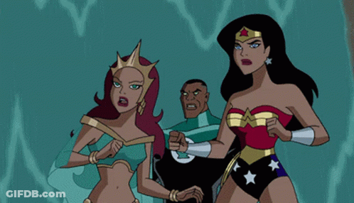 A Woman In A Wonder Woman Costume Is Standing Next To Another Woman In A Blue Dress GIF