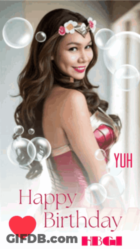 A Woman In A Wonder Woman Costume Is Surrounded By Bubbles And Says Happy Birthday GIF