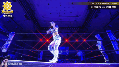 A Woman In A Wrestling Ring With A Logo That Says #Pw_mg On It GIF