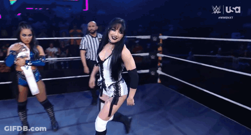 A Woman In A Wrestling Ring With A USA Logo On The Bottom GIF