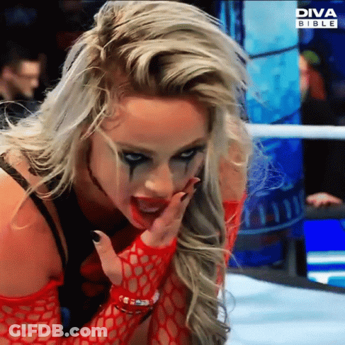 A Woman In A Wrestling Ring With Diva Bible On The Bottom GIF