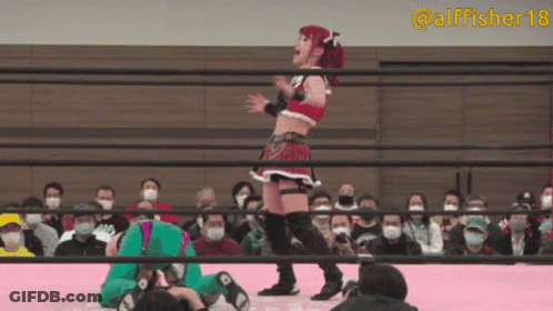 A Woman In A Wrestling Ring With The Hashtag Alfisher18 GIF