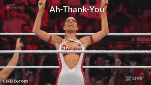 A Woman In A Wrestling Ring With The Words Ah-Thank-You Written Above Her GIF