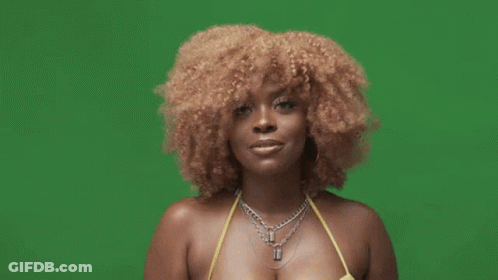 A Woman In A Yellow Bikini And Black Gloves Is Giving A Thumbs Up Sign . GIF