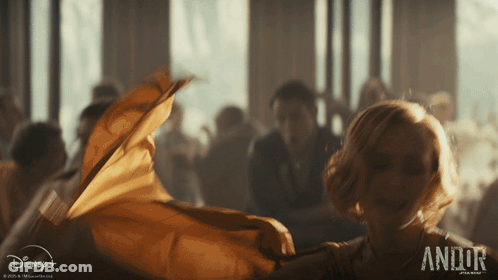 Woman In Yellow Dress Dancing In Front Of Disney+ GIF