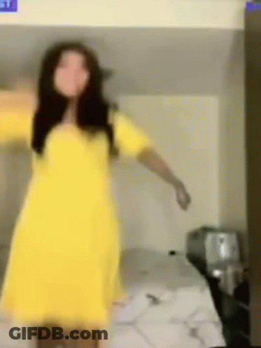 A Woman In A Yellow Dress Is Dancing On A Bunk Bed . GIF