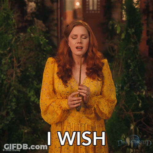A Woman In A Yellow Dress Is Holding A Wand And The Words I Wish Are Above Her GIF