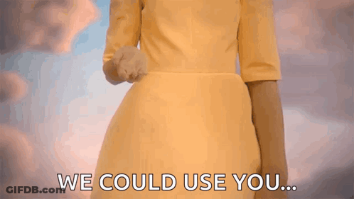 A Woman In A Yellow Dress Is Holding Out Her Hand And Says We Could Use You GIF