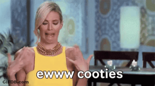 A Woman In A Yellow Dress Is Making A Funny Face While Holding Her Breasts And Says Ewww Cooties . GIF