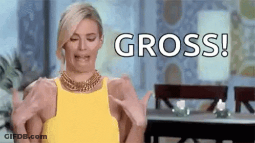 A Woman In A Yellow Dress Is Making A Funny Face While Holding Her Hands Up And Saying Gross . GIF