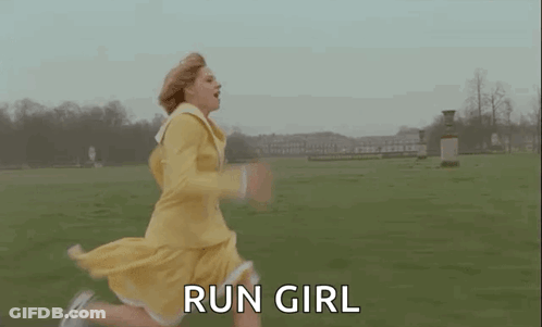 A Woman In A Yellow Dress Is Running In A Field With The Words `` Run Girl '' . GIF